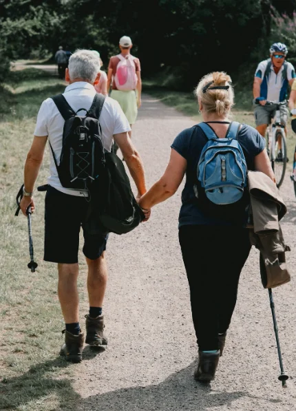 Elderly couple walking in park for heart and brain health