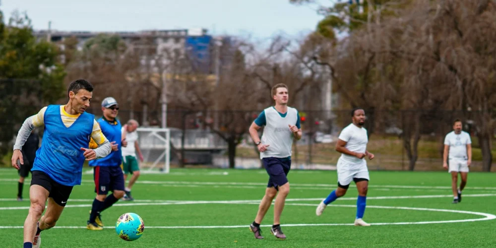 Older adults playing soccer outdoors for healthy aging