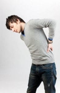 Oakville lower back pain — man holding back