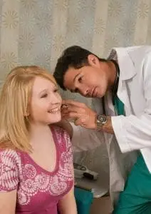 doctor investigating patient for Benign Paroxysmal Positional Vertigo BPPV