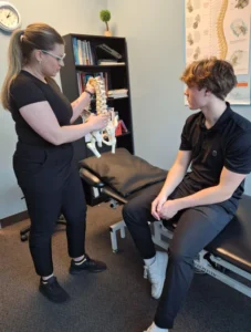 Healthcare professional discussing golf-related injuries with patient