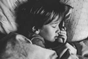 Rest and recovery for young athletes — child sleeping 8–10 hours to prevent overuse injuries
