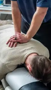 A physiotherapy treatment session at Sheddon Clinic, focusing on injury recovery and rehabilitation techniques.